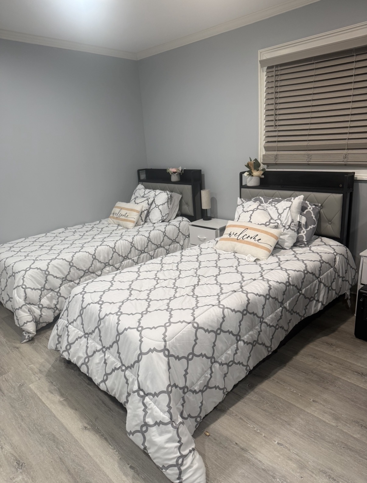 A welcoming two-bed resident room inside Activity House