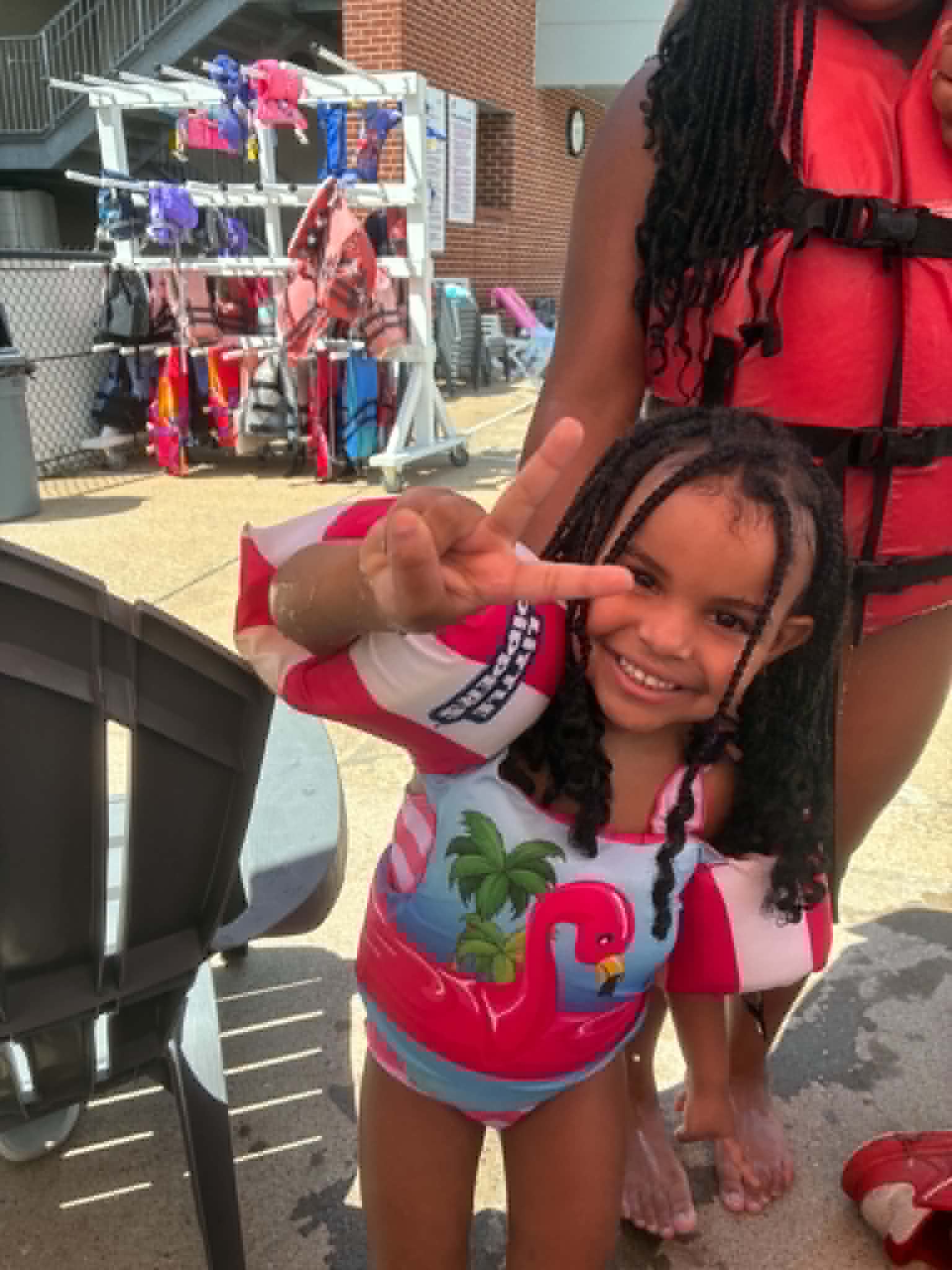 A child smiling during a Step-Up Recovery community outreach event